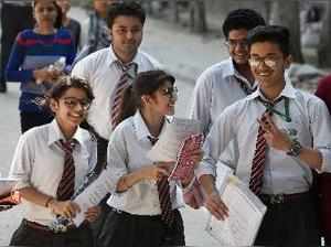 New Delhi: Students outside an examination centre after appearing in CBSE Board ...