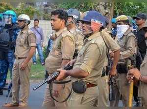 Aligarh: Uttar Pradesh Police personnel deployed outside university gate during ...