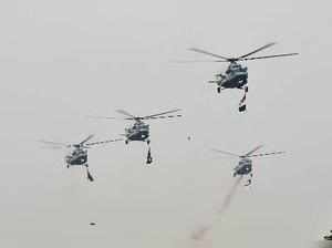 New Delhi: Helicopters shower flower petals during full dress rehearsal for the...