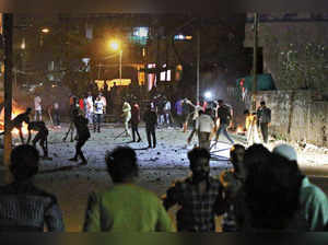 Aurangabad: Rioters hurl stones and stickks during a communal riot that escalate...
