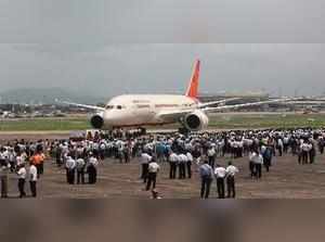 FILE PHOTO:::: New Delhi: Air India employees gather around a newly acquired Air...