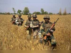Jammu: BSF personnel patrol along the international border in Jammu on Sunday. T...