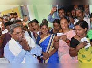Mysore: Karnataka Chief Minister Siddaramaiah greets his supporters after voting...
