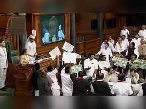 New Delhi: Opposition members protest in front of Lok Sabha Speaker Sumitra Mah...