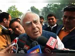 New Delhi: Congress leader Kapil Sibal addresses the media on 2G outside the Par...