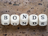Govt bonds surge, call rates turn higher