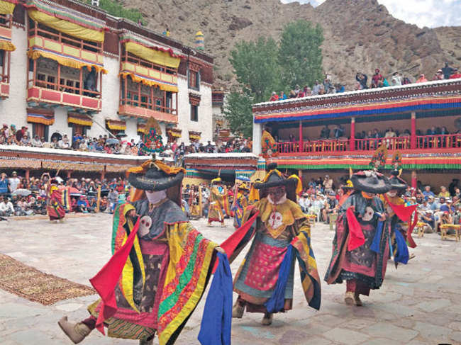 the dancers in colourful traditional garb, masks depicting many emotions and hand gestures spread the message - victory of good over evil.