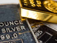 Gold eases off nine-month peak as U.S. dollar, yields gain