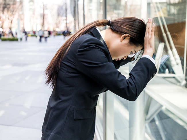work-tired-sorry-apologise-woman-office-GettyImages-829043318