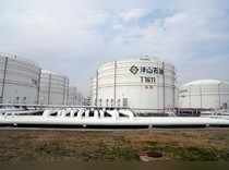FILE PHOTO: Oil tanks are seen at an oil warehouse at Yangshan port in Shanghai