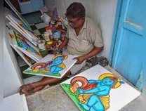 Kolkata: An artist paints a photo of Lord Krishna ahead of Janmashtmi festival, ...