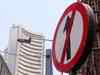 Sensex slumps 218 pts on Fed rate hike, F&O expiry; Nifty below 11K-mark