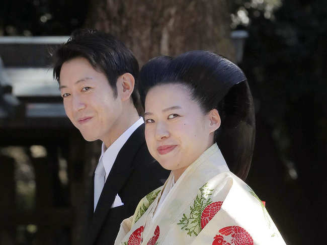 Commoner Kei Moriya and Princess Ayako (R)