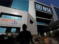 A guard walks past the NSE (National Stock Exchange) building in Mumbai