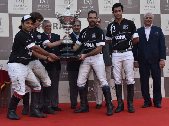 The-winning-team,-Sona-Koyo,-captained-by-Sanjay-Kapur,-lifts-the-prestigious-trophy-for-the-Sir-Pratap-Singh-Polo-Cup