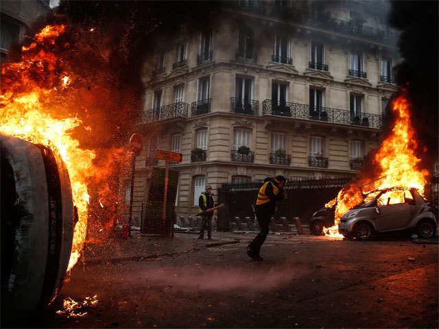 ​Riot debris covers Paris streets