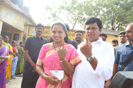 Image result for Telangana Rashtra Samithi's K Kavitha with her husband casts her vote for Lok sabah 2019