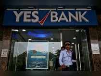 A watchman steps out of a Yes Bank branch in Mumbai