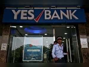A watchman steps out of a Yes Bank branch in Mumbai