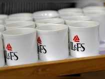 Logo of IL&FS is seen printed on mugs at its headquarters in Mumbai