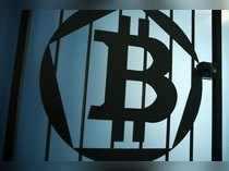 A Bitcoin (virtual currency) logo is pictured on a door at La Maison du Bitcoin in Paris