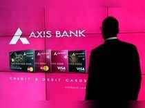 A visitor watches an Axis Bank's advertisement at its corporate headquarters in Mumbai