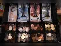 A shop cash register is seen with both Sterling and Euro currency in the till at the border town of Pettigo