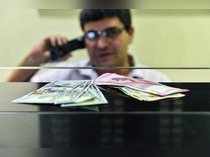 New Delhi: Currency seen at a forex bureau counter after the Rupee hit a new all...