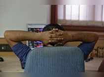 A broker reacts while trading at his computer terminal at a stock brokerage firm in Mumbai