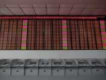 An electronic stock information board displaying zero numbers on the latests stock prices before the opening of the first trading day after the week-long Lunar New Year holiday at a brokerage house in Shanghai