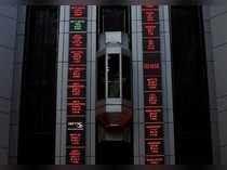 An elevator travels next to electronic boards displaying stock figures at the National Stock Exchange (NSE) building in Mumbai