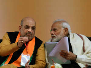 Prime Minister Narendra Modi speaks with BJP National President Amit Shah  TNN