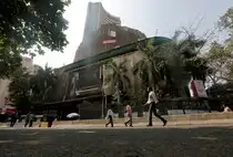 People walk past the Bombay Stock Exchange (BSE) building in Mumbai