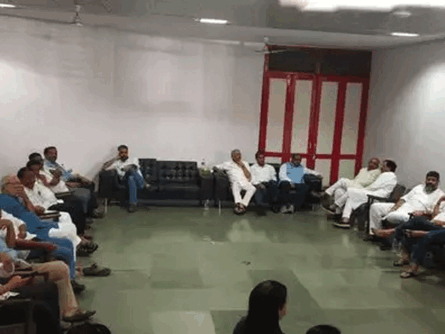 Union minister Shripad Naik and other VIPs wait in Kala Academy waiting room after paying last respects to Parrikar