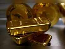 FILE PHOTO: Gold bars are stacked in safe deposit boxes room of the ProAurum gold house in Munich