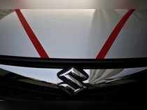 FILE PHOTO : The logo of Maruti Suzuki India Limited is seen on car parked outside a showroom in New Delhi