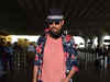 In the pink of health: Irrfan Khan spotted at Mumbai airport, uncovers face for paparazzi