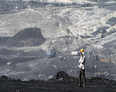 Government twists norms, coal mines rejoice