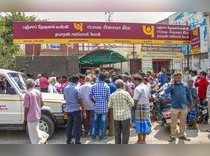 Tiruchirapalli : People are waiting in front of the Punjab National Bank where v...