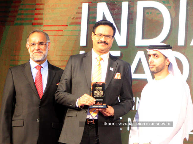 Dr Dhananjay Datar receives the Forbes Middle East award from H E Navdeep Singh Suri (left) and Sheikh Mohammed Bin Maktoum Bin Juma Al Maktoum