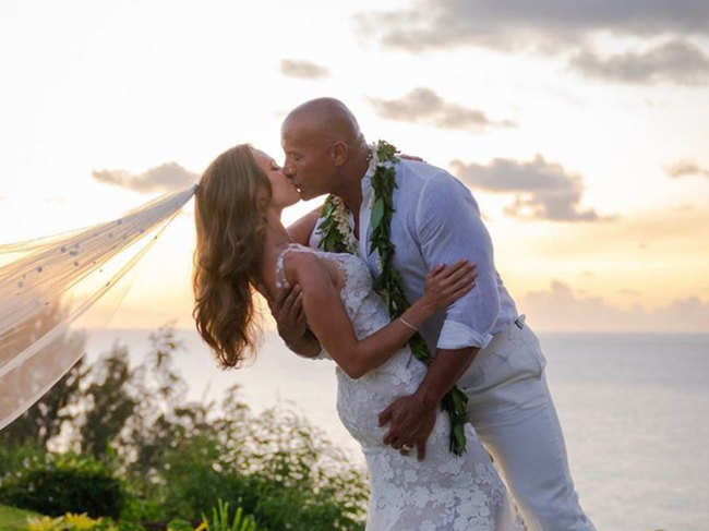 The couple shared a kissing picture ​against the sunset backdrop with Lauren Hashian's veil blowing in the wind. ​