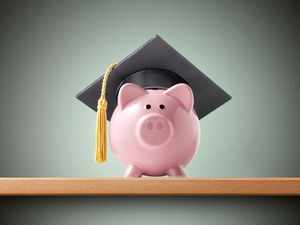 education-savings-piggy-bank-with-graduation-cap-picture-id537390476
