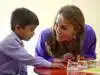 Kate interacts with a student