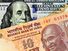 Rupee settles 12 paise higher at 70.90 against dollar