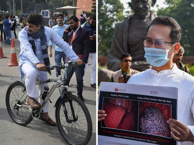 While​ BJP MP Manoj Tiwari​ (L) arrives Parliament in a bicycle, Congress MP Gaurav Gogoi displays a placard to protest against government inaction on growing pollution, on the first day of the Winter Session of Parliament, in Delhi.​