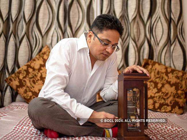 Gaurav Mehta's wooden cabinet outside his room has hand-wound watches from around the world.