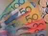 Australian dollar weighed down by floods