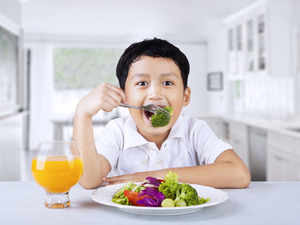 kid-eating-broccoli-Getty