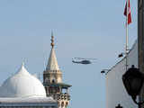 A Tunisian military helicopter flies over Tunis