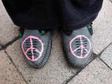 Shoes with hand drawn peace signs